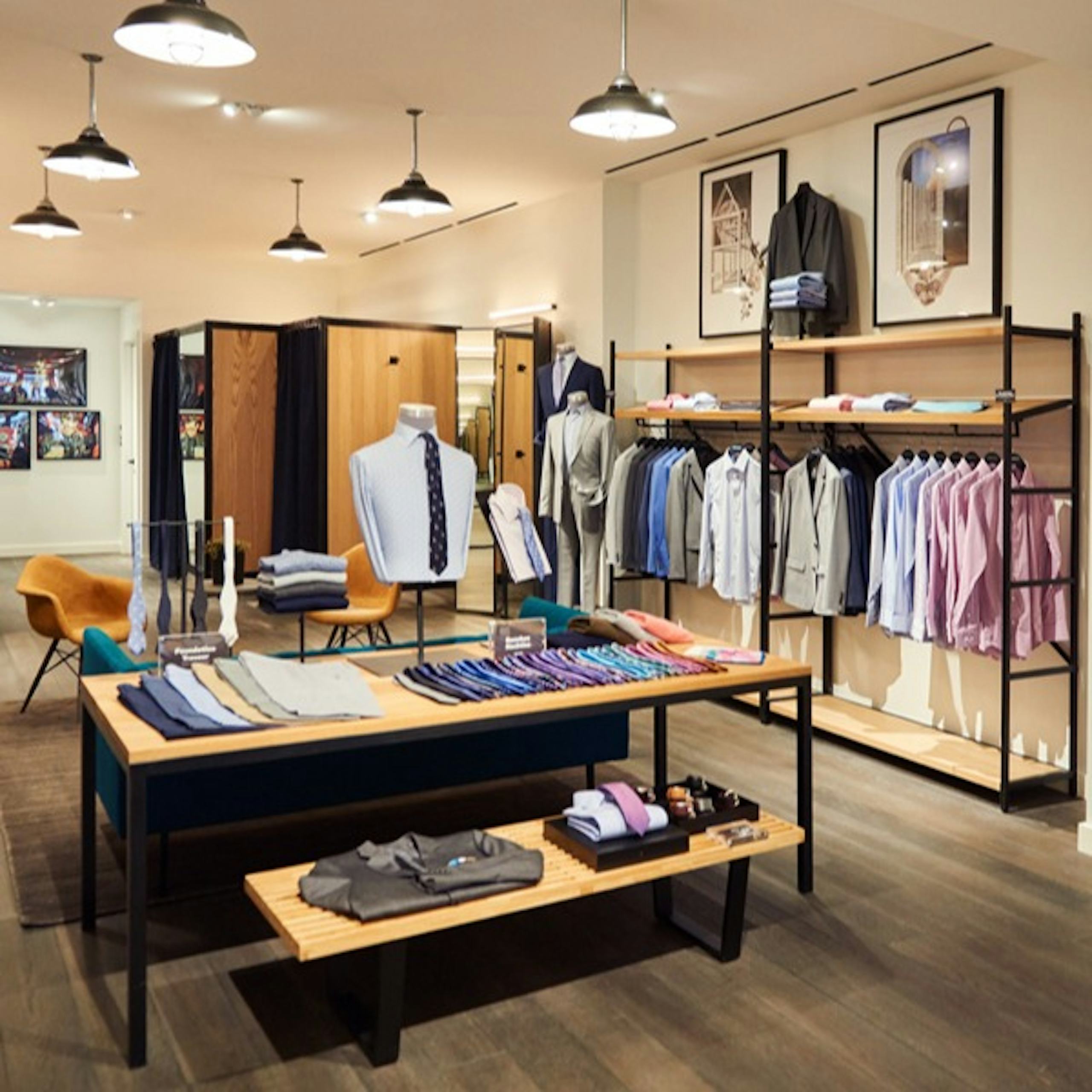 Image of Bonobos store display in Woodward Ave, Detroit. Display with Suits, Blazers, Dress  Shirts, and Casual Shirts.