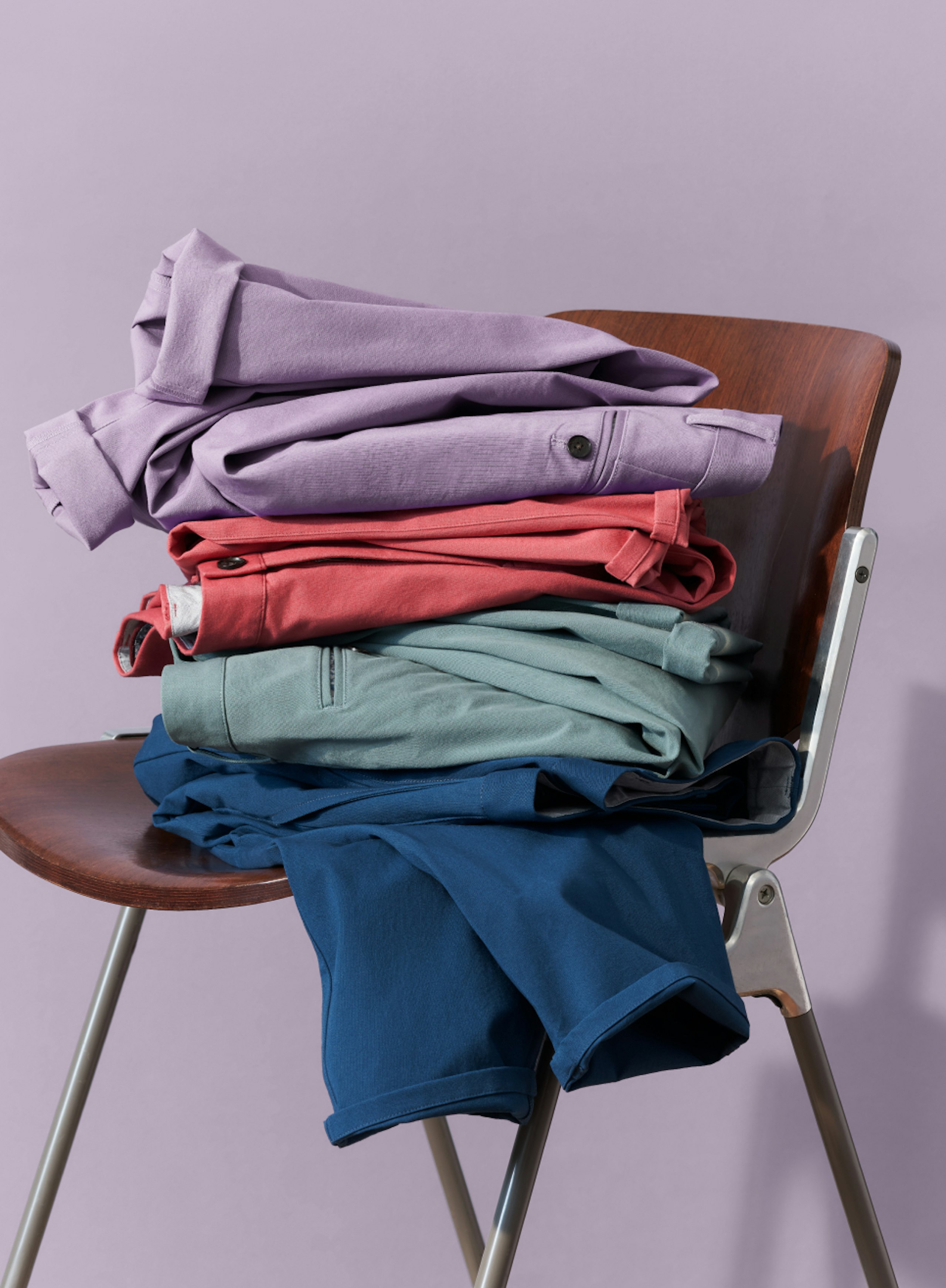 Stack of Stretch Washed Chino 2.0s in Lavender, Slate Rose, Atlantic Blue, and Navy Peony