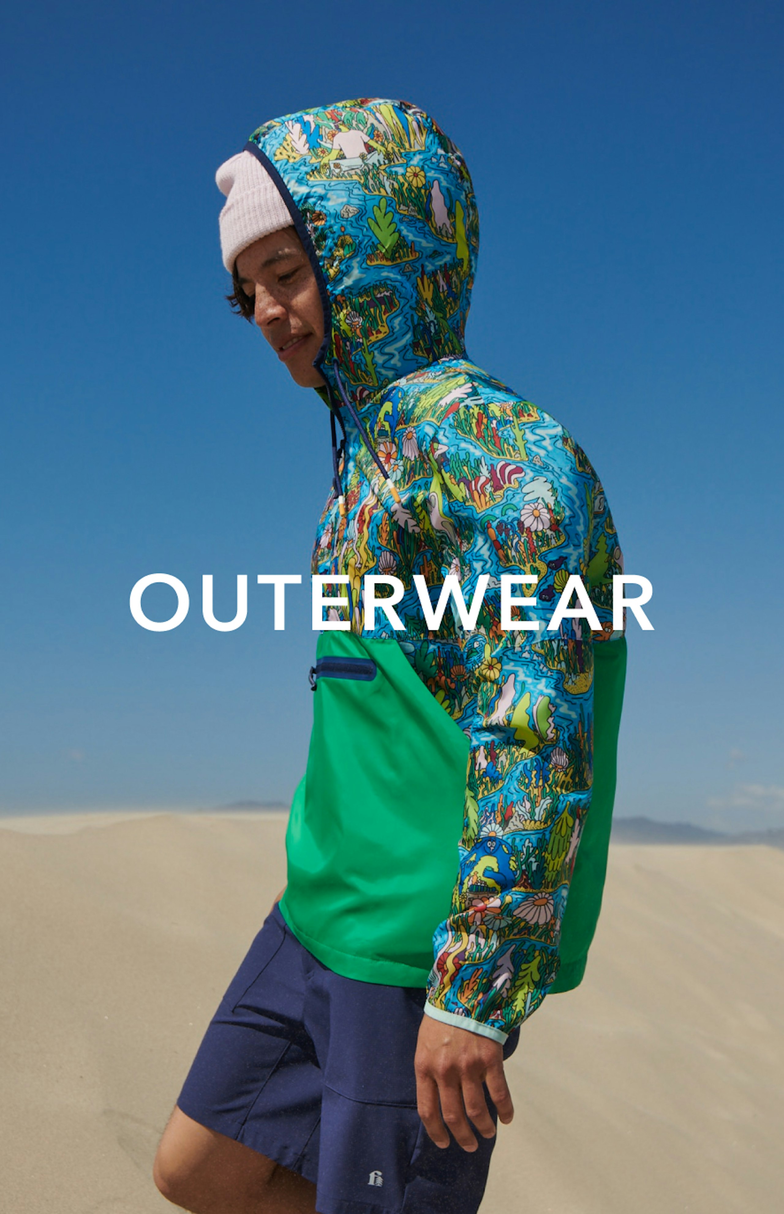 young man wearing Packable Water Resistant Mixed Media Jacket Text reads "OUTERWEAR"