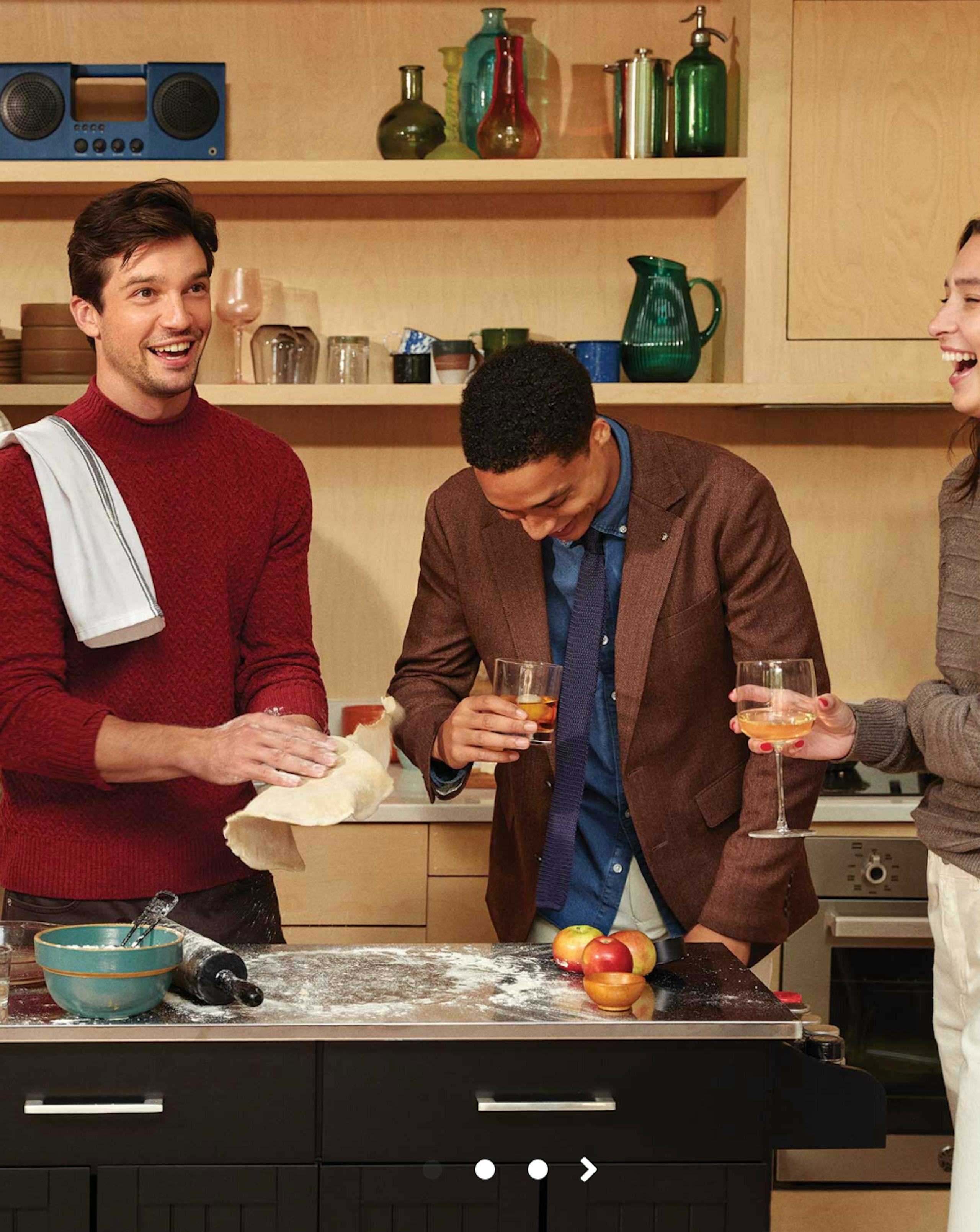 Group of friends wearing men's winter fashion and cooking