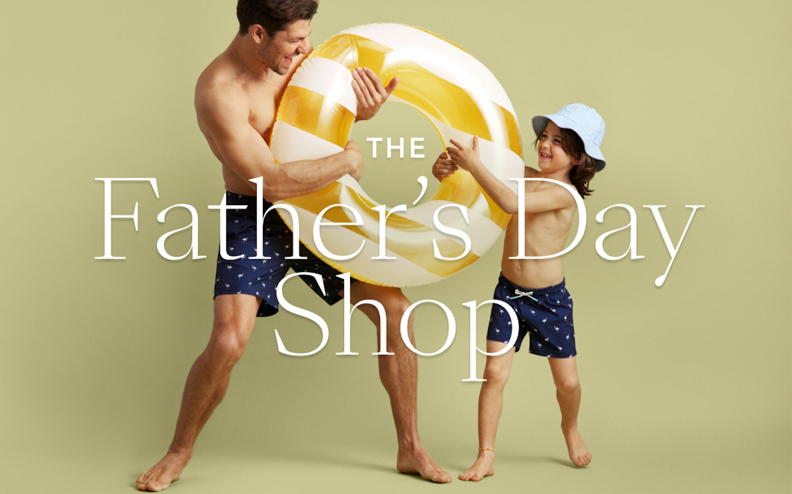 Dad wearing Riviera Recycled Swim Trunks holding water tube with his son wearing matching Bonoboys Swim Trunks