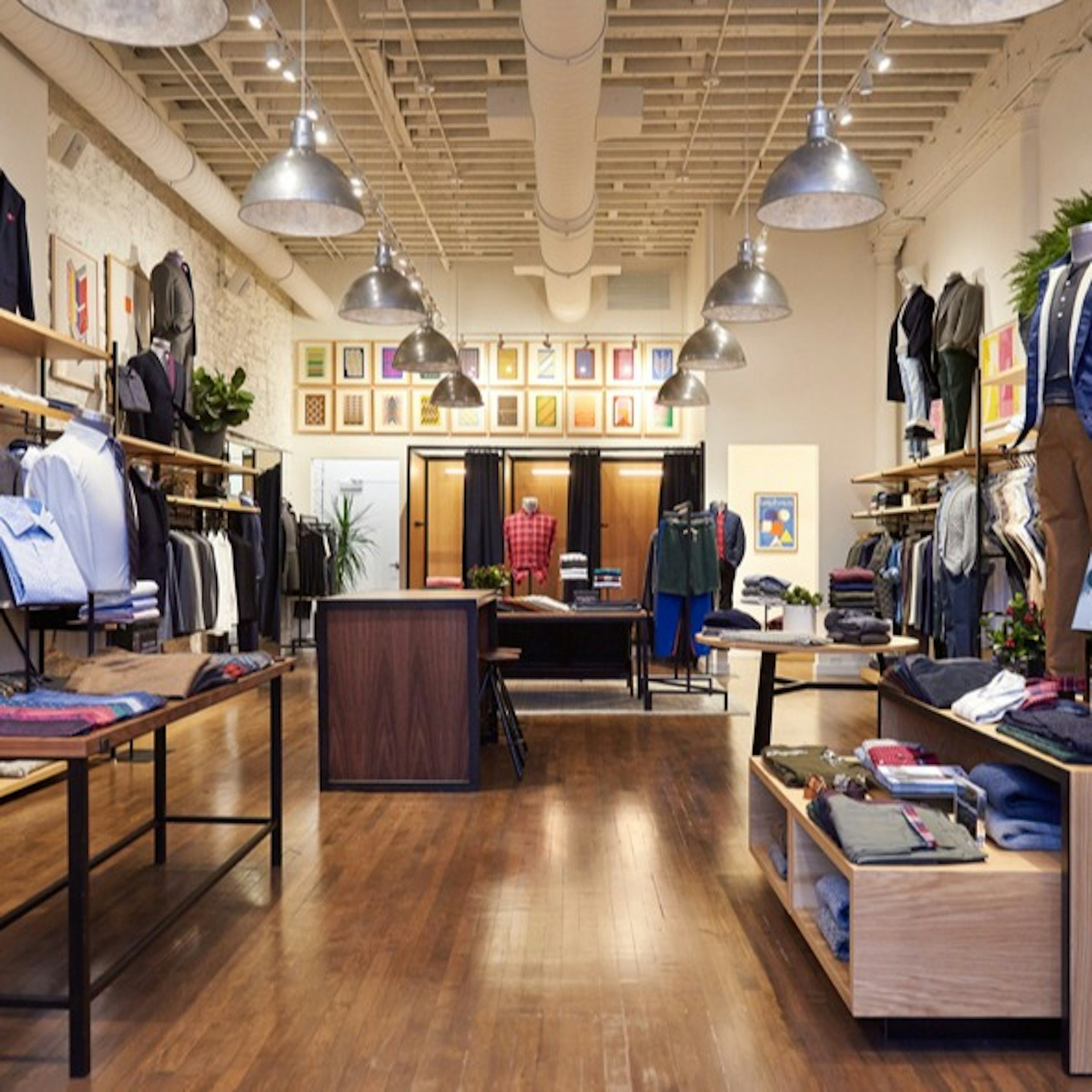 Image of Bonobos in North Loop, Minneapolis. Store Display shows menswear including business casual shirts, casual shirts, dress pants and outerwear. 