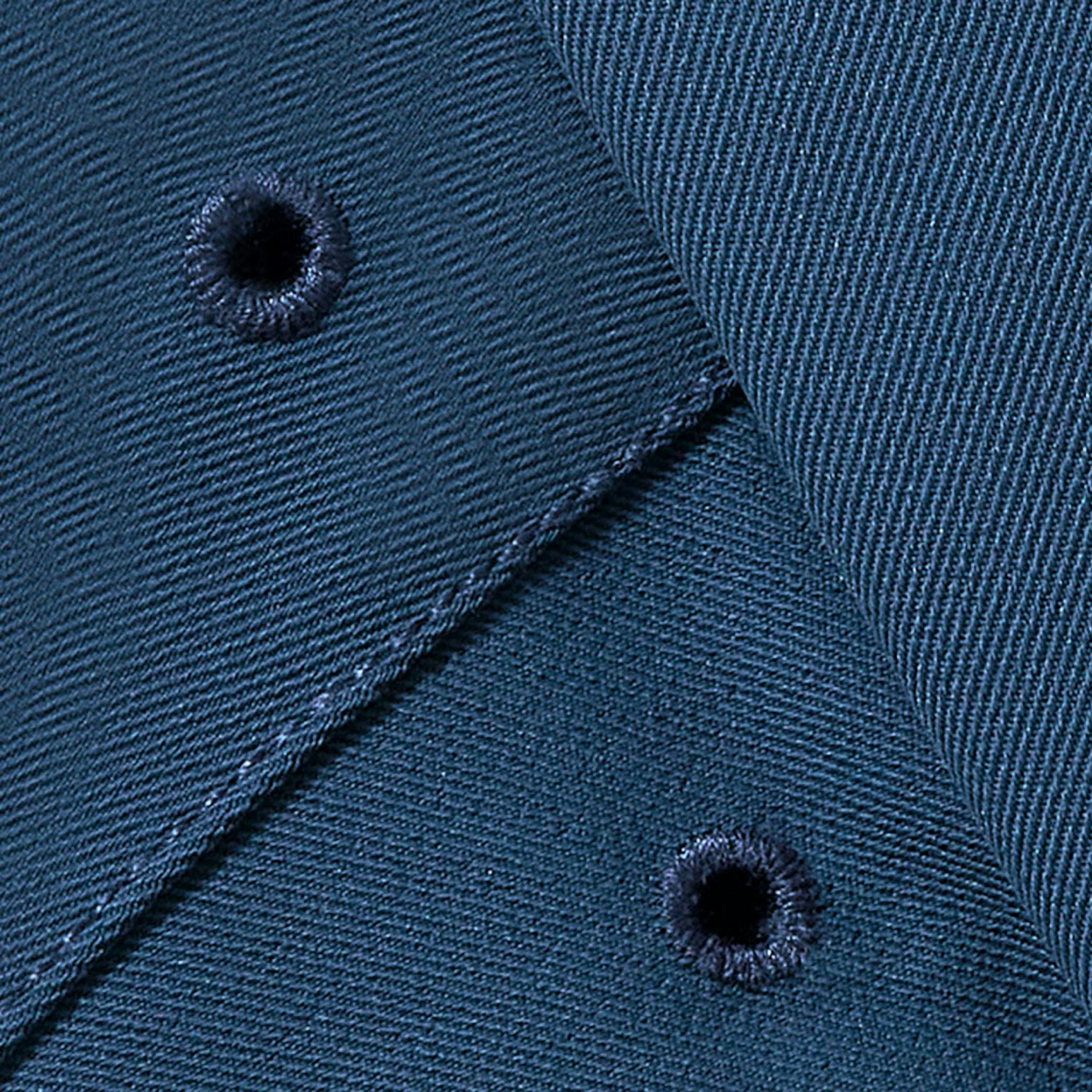 image of embroidered eyelets on the Marine Blue color of Justin Rose Highland Tour Short